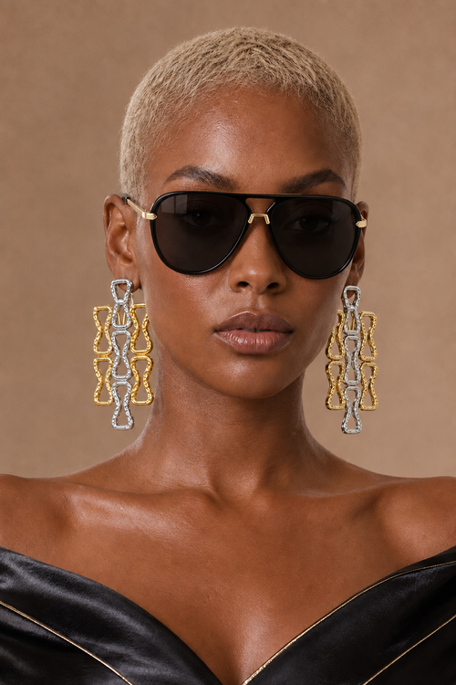 Amara oversized aviator shades in Black worn by a BLANC LOVE model
