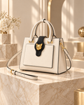 Gilded Feline Structured Leather Satchel in Cream White front three-quarter view
