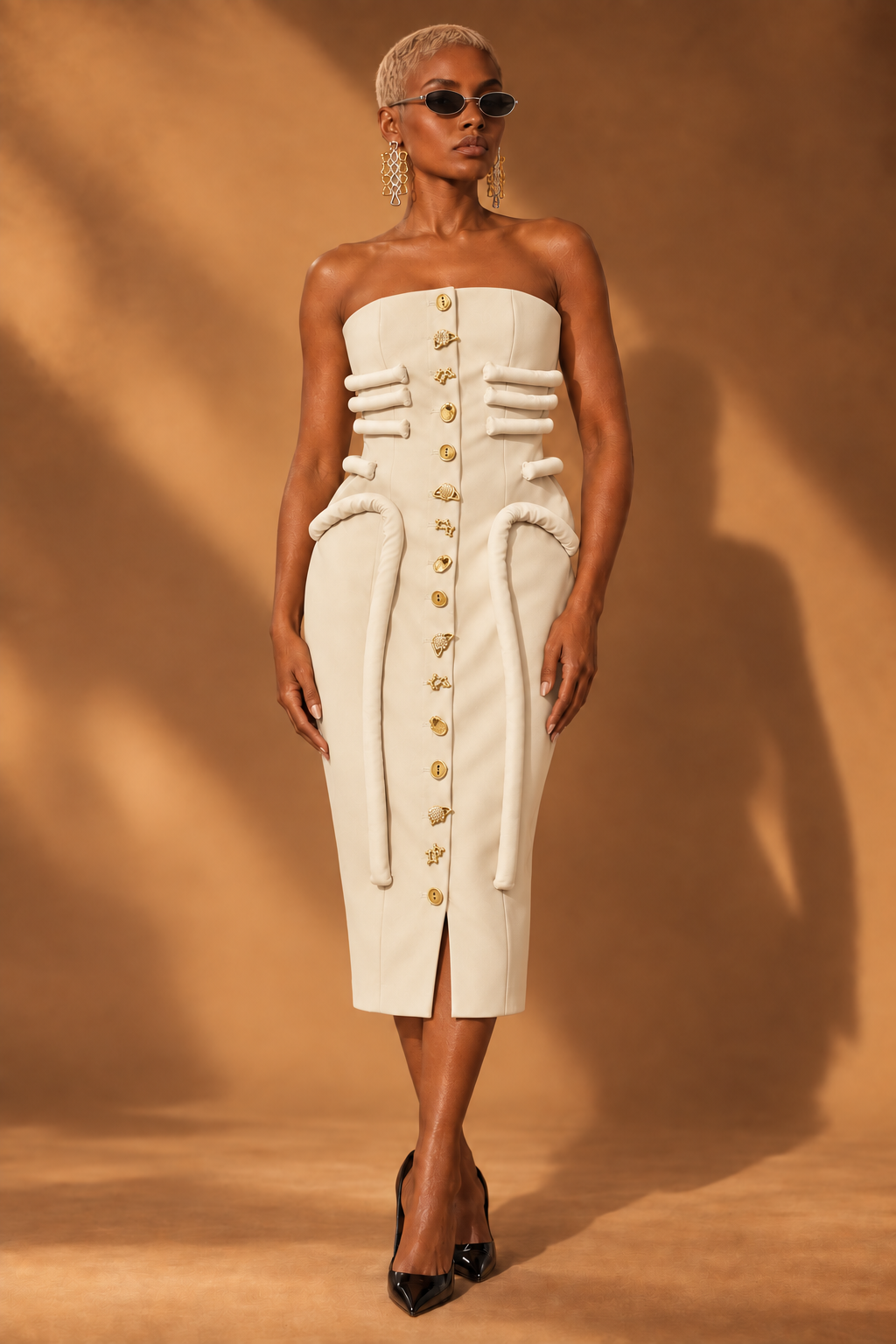 Cream strapless sculptural midi dress with gold charm buttons front view