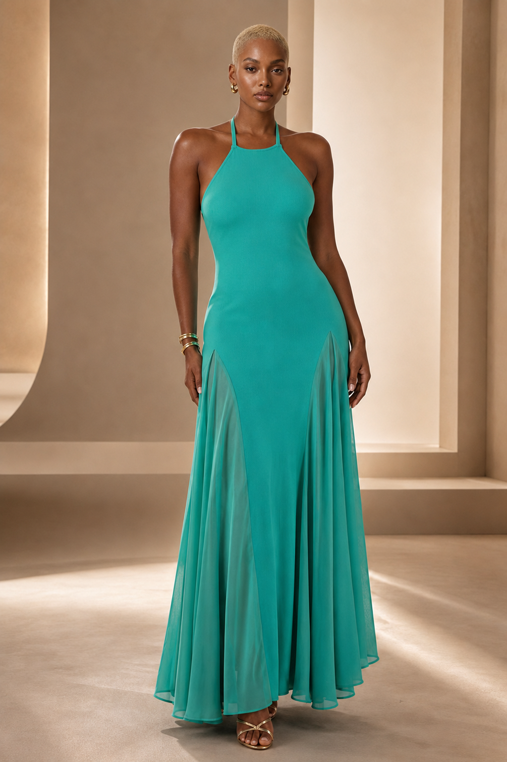 Black female model wearing the Turquoise Muse halter maxi dress