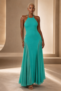 Black female model wearing the Turquoise Muse halter maxi dress